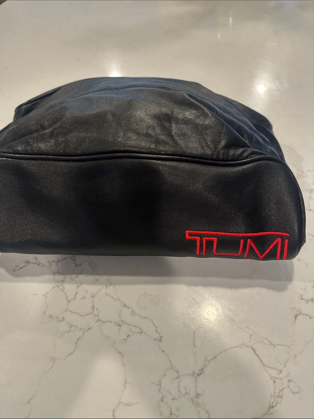 Tumi Black Toiletry Kit with Red Logo Embroidery - leather